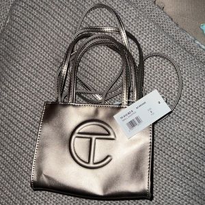 Like new small bronze telfar